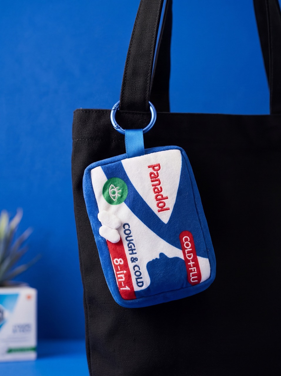 Panadol Cold+Flu plushie on tote bag