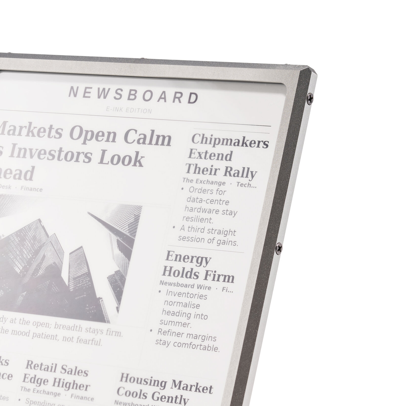 Detail shot of the E Ink display screen showing a crisp newspaper-style news layout — proof of screen quality for the Kickstarter campaign