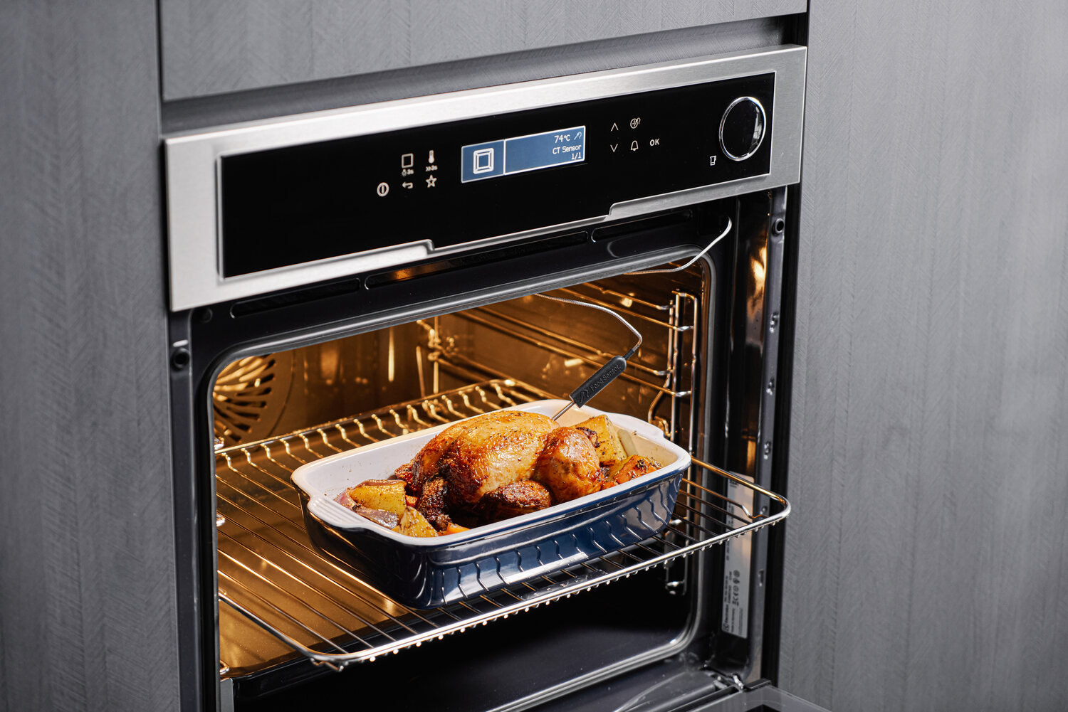 Electrolux built-in oven with a glowing roast chicken — product photography Singapore