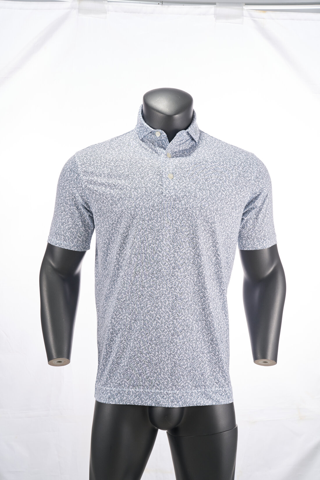 FootJoy monochrome-print golf polo photographed on a ghost mannequin against white
