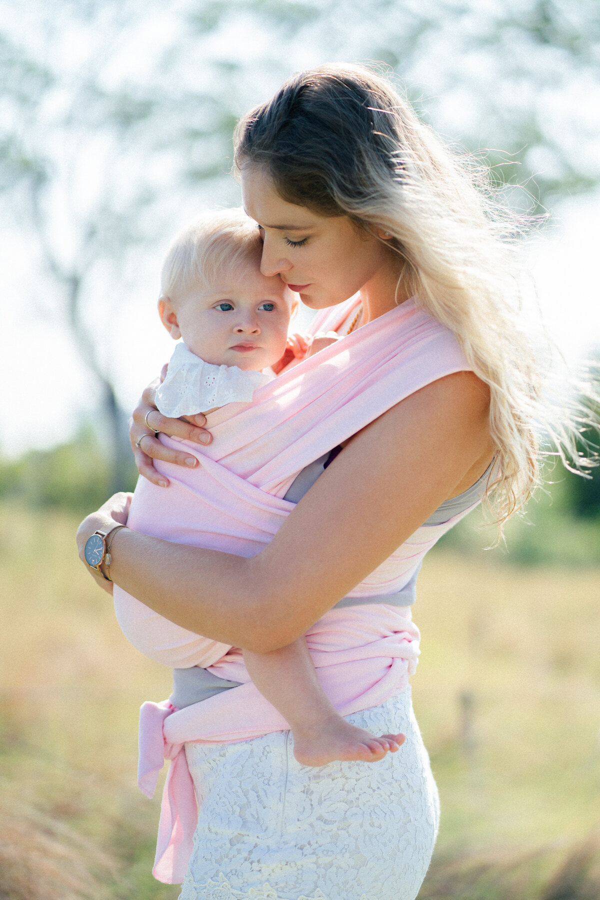 KeaBabies baby carrier wrap with mother and baby outdoors — lifestyle photography