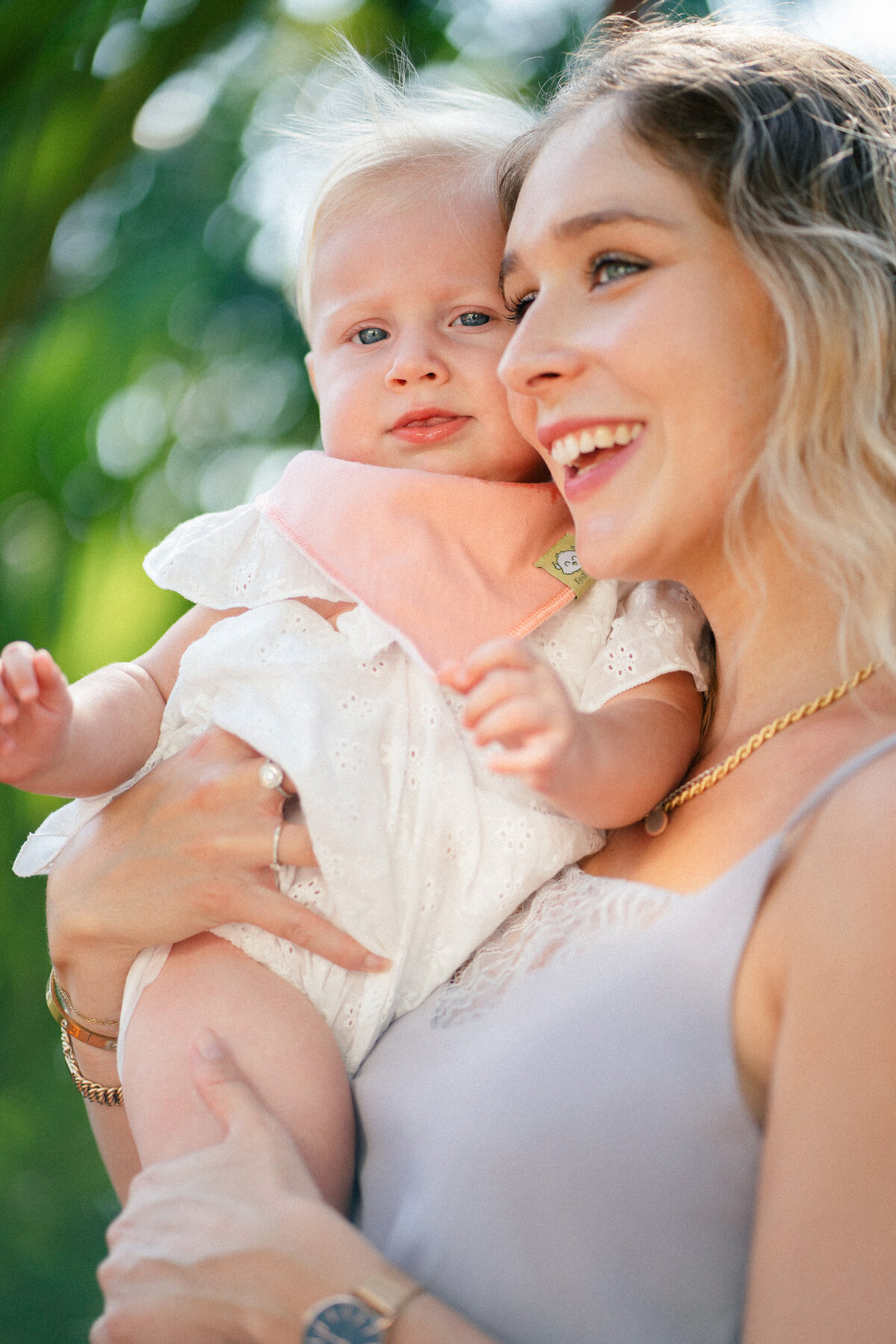 KeaBabies mother and baby laughing outdoors — lifestyle photography