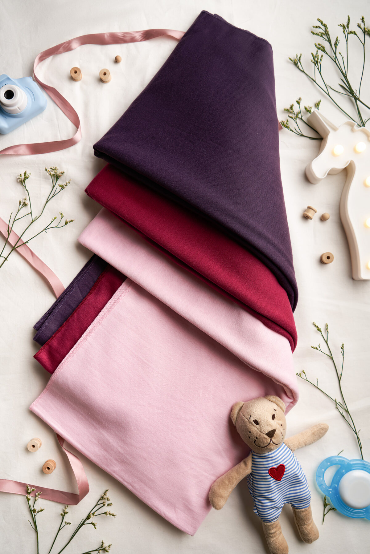 KeaBabies swaddle blankets folded flat-lay — e-commerce product photography Singapore