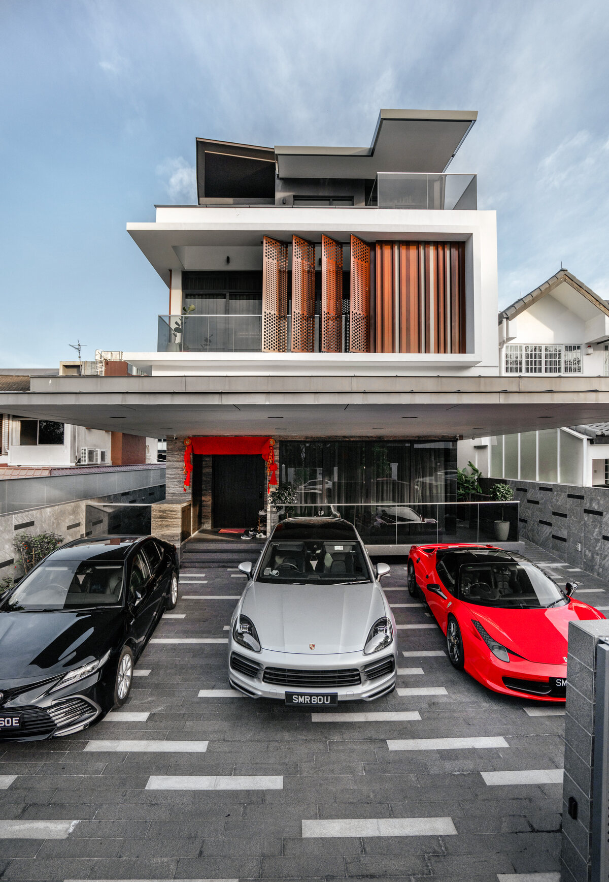 Luxury landed home driveway with supercars — luxury home architecture photography