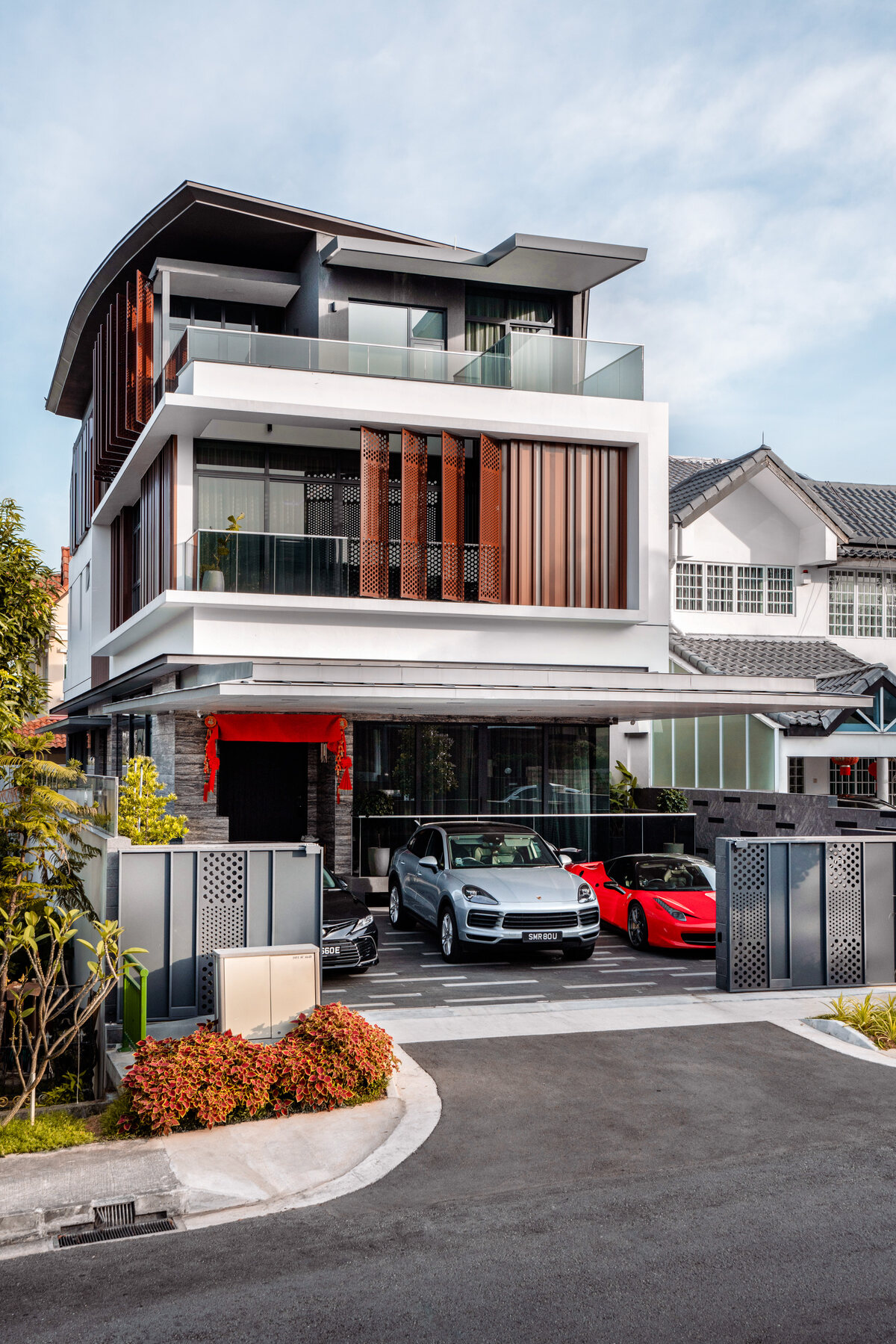 Luxury landed home facade and driveway with supercars — architecture photography Singapore