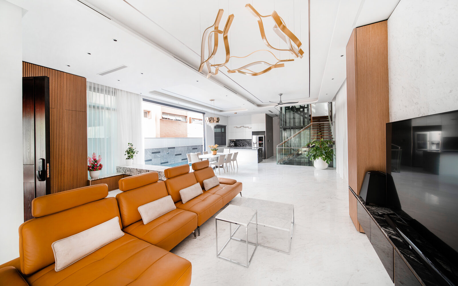 Luxury landed home living room with leather sofa and sculptural lighting — interior photography Singapore