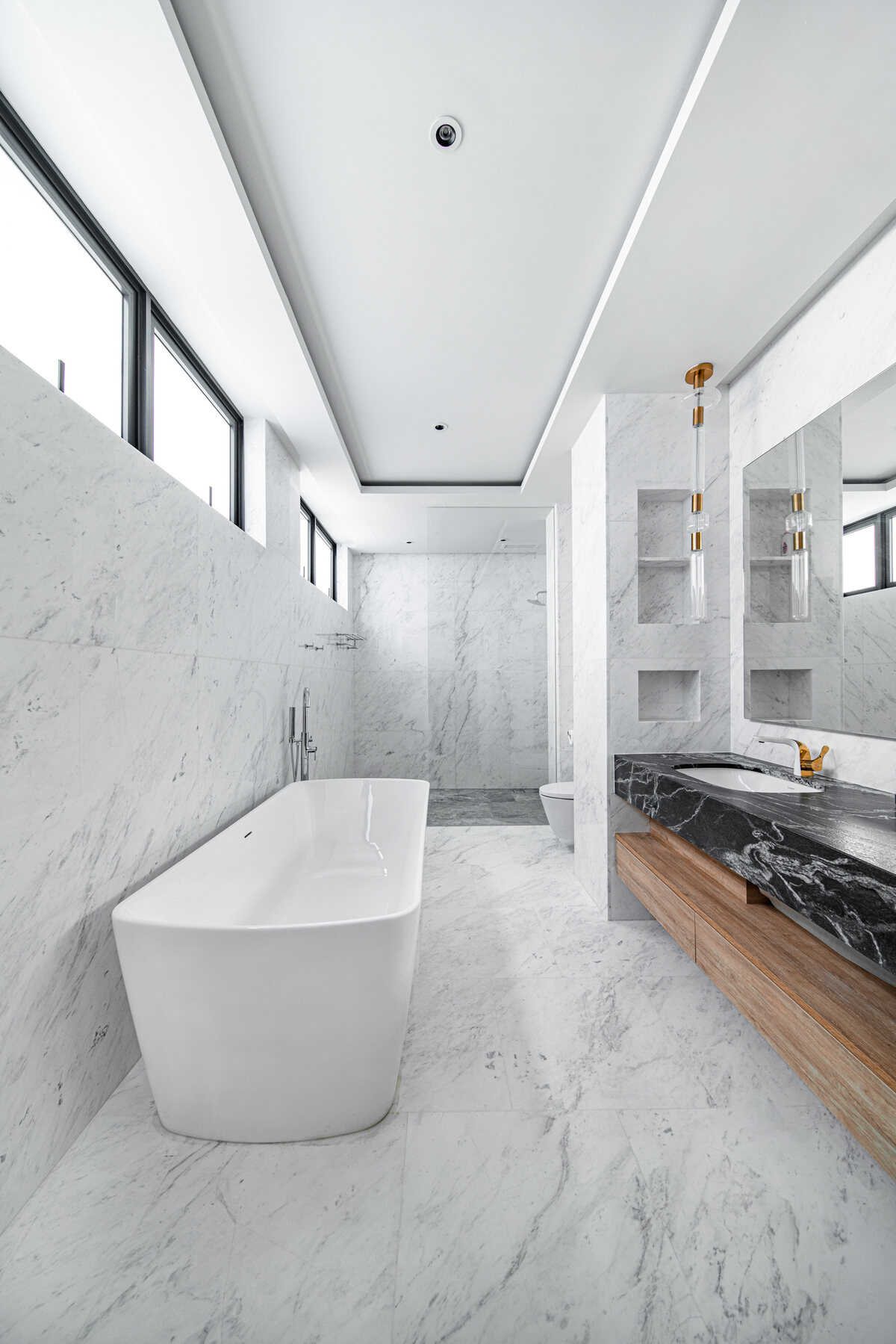 Luxury landed home marble bathroom with freestanding tub — interior photography Singapore