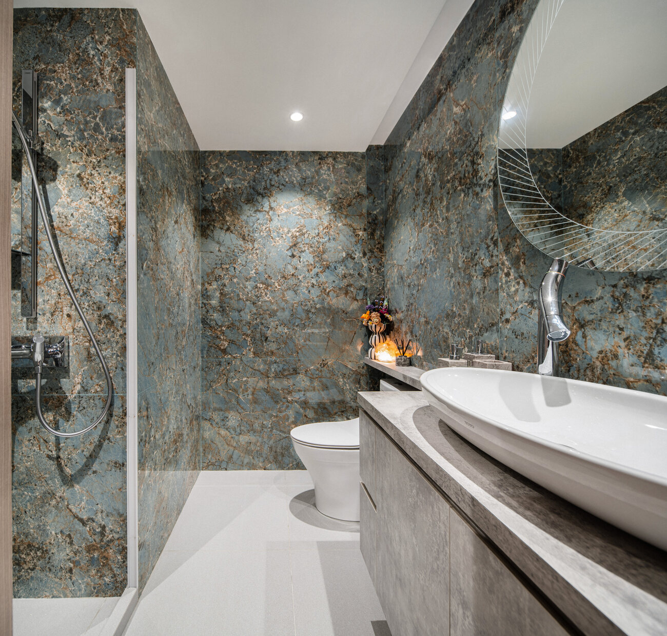 Premium residential bathroom in dramatic stone with vessel basin — interior photography Singapore