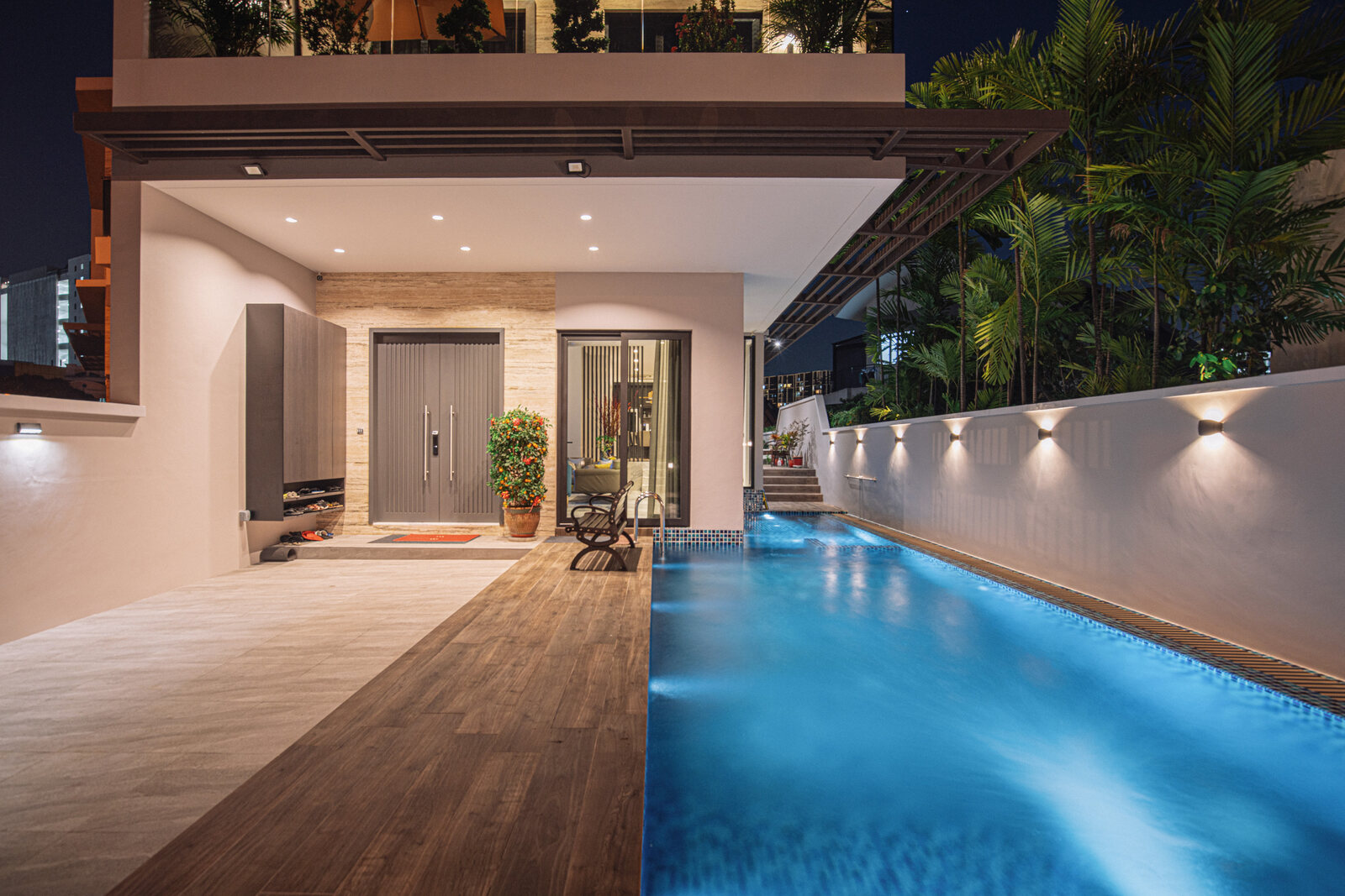 Tai Keng semi-detached home pool and timber deck lit in the evening — real estate photography Singapore